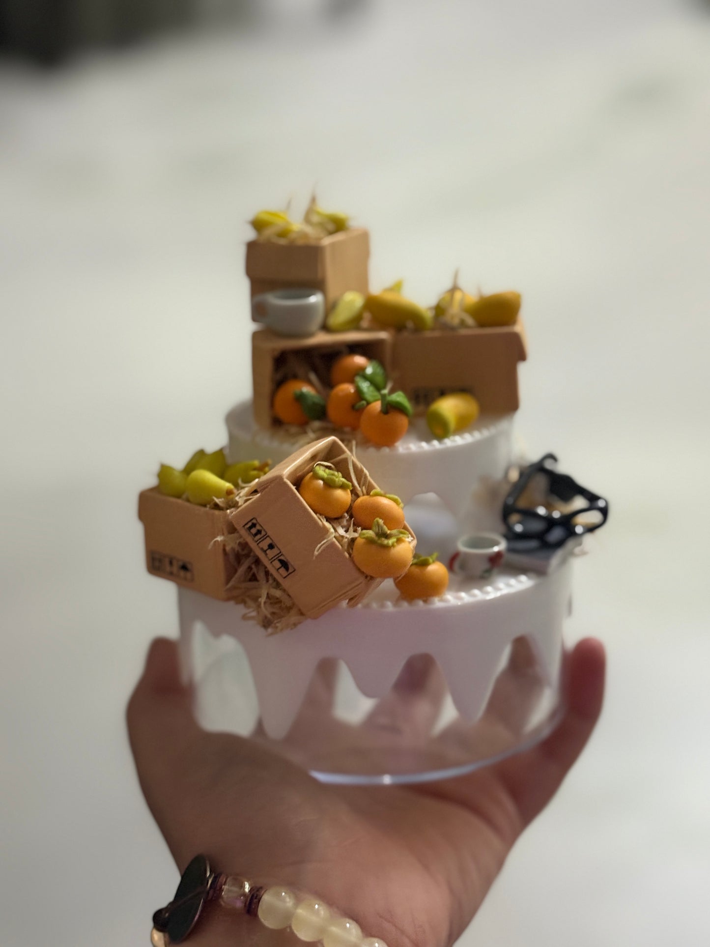 A handcrafted miniature two-compartment storage box decorated with tiny fruit crates, mugs, and rustic accessories, designed for storing small items like rings, earrings, candies, or trinkets; perfect as a charming tabletop organizer or gift box.