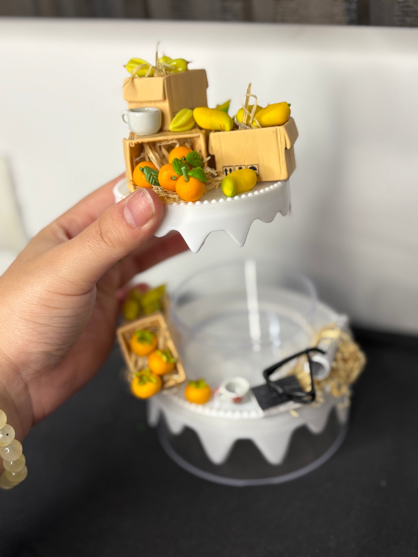 A handcrafted miniature two-compartment storage box decorated with tiny fruit crates, mugs, and rustic accessories, designed for storing small items like rings, earrings, candies, or trinkets; perfect as a charming tabletop organizer or gift box.