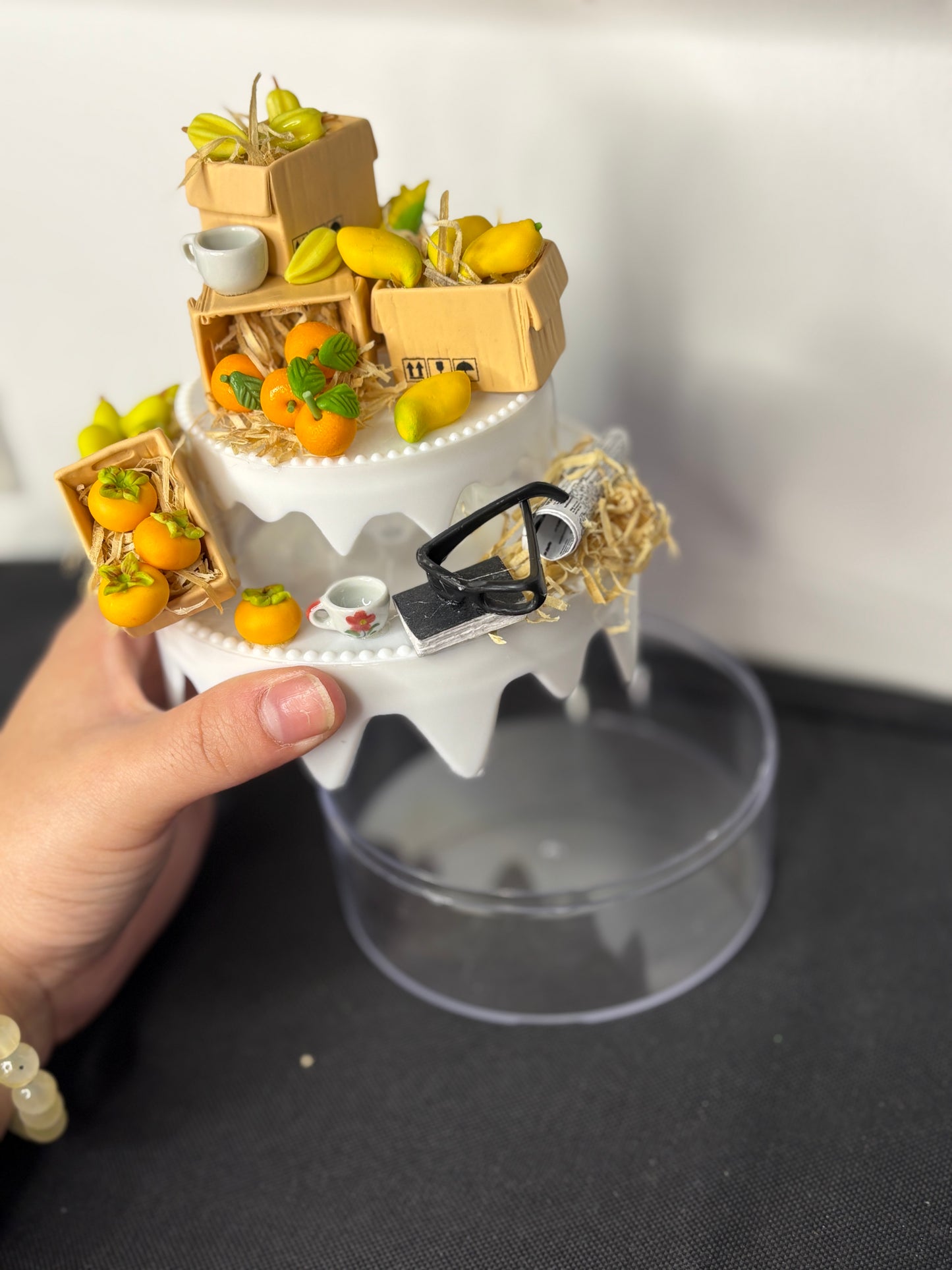 A handcrafted miniature two-compartment storage box decorated with tiny fruit crates, mugs, and rustic accessories, designed for storing small items like rings, earrings, candies, or trinkets; perfect as a charming tabletop organizer or gift box.