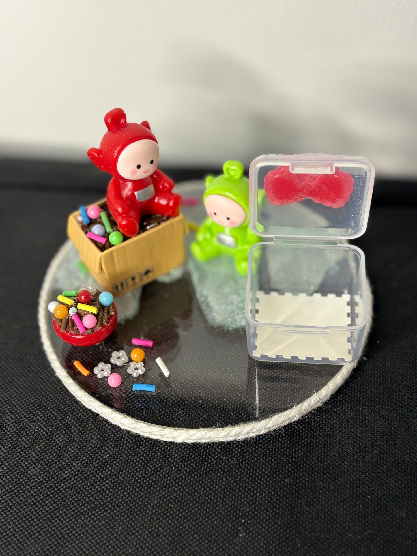 A handmade miniature platter featuring cartoon-inspired characters with playful accessories and candy-themed details, designed for holding small items like rings, earrings, toffees, or trinkets; perfect for decor or gifting.