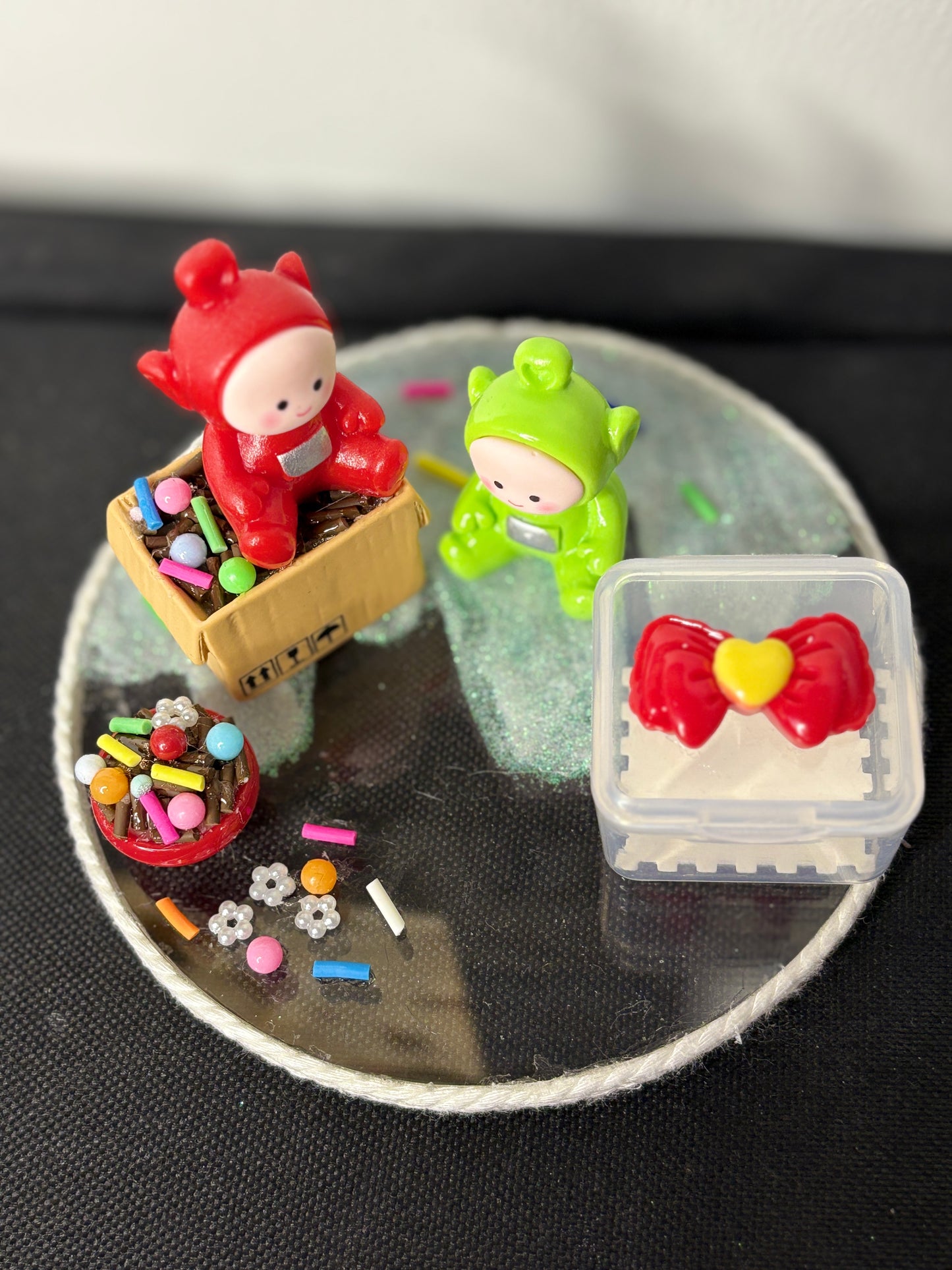 A handmade miniature platter featuring cartoon-inspired characters with playful accessories and candy-themed details, designed for holding small items like rings, earrings, toffees, or trinkets; perfect for decor or gifting.