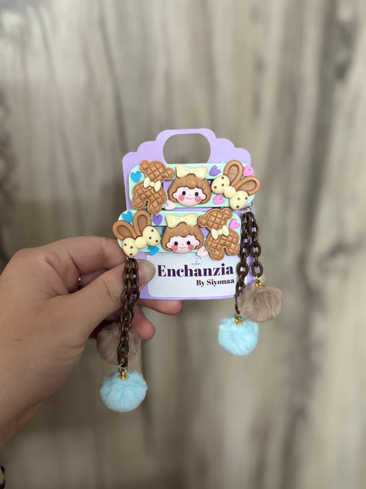 Cute pastel clips with chocolate girl designs, bunny cookies, and fluffy Pom Poms. Adds a sweet, fun vibe to any hairstyle—perfect for kids and teens.