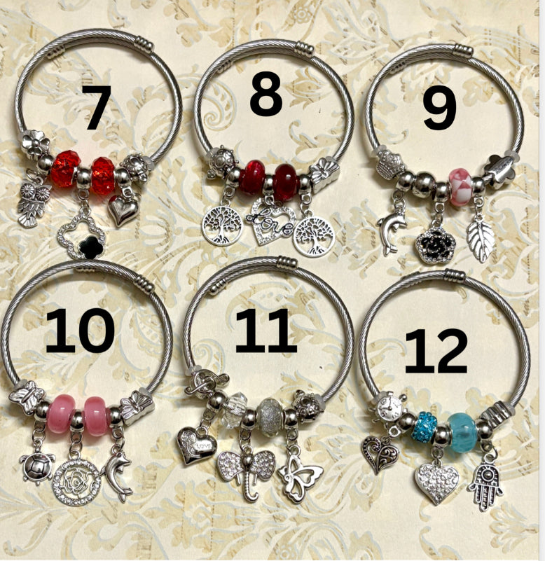 Stylish silver Pandora-inspired charm bracelets with hearts, butterflies, and trees. Elegant adjustable bangles perfect for gifting or everyday use. 