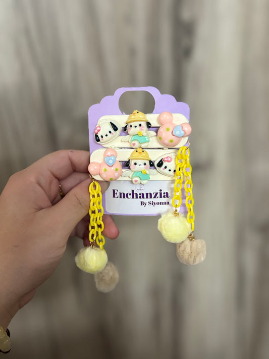 Pastel Minnie Mouse hair clips with yellow chain dangles and fluffy pom poms—adorable cartoon-themed hair accessories ideal for kids’ fashion and fun hairstyles.
