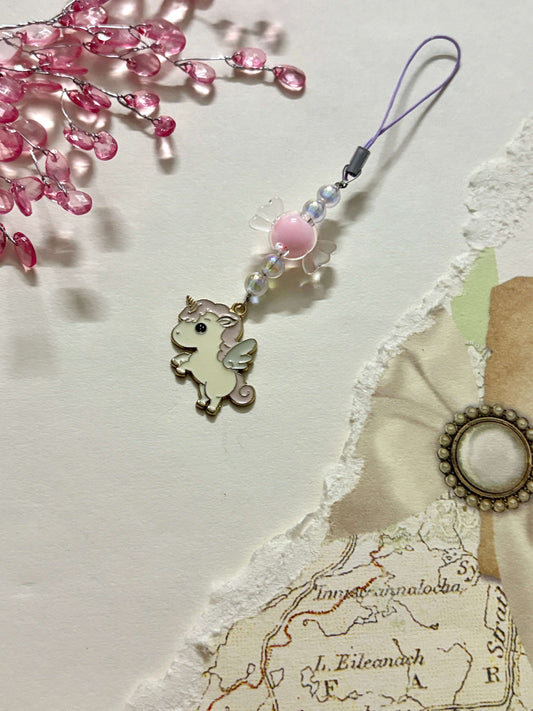 Adorable phone charm featuring a winged unicorn pendant paired with glossy beads and a loop strap, perfect for phones, keychains, or bags.