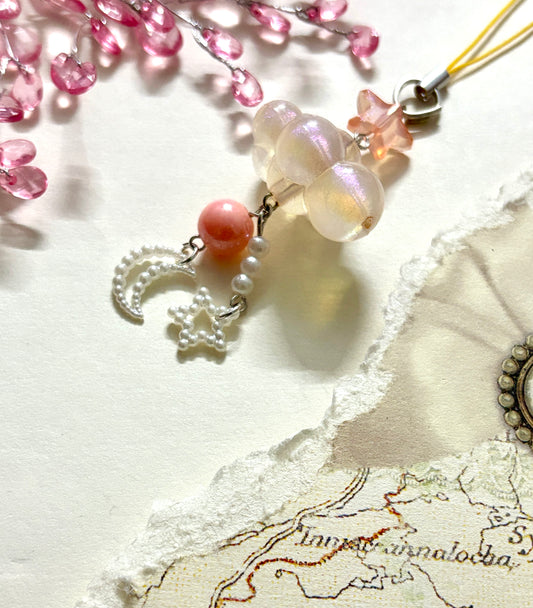 Aesthetic beaded phone charm with cloud-shaped beads, moon and star danglers, and pearls. A soft dreamy accessory for phones, bags, or gifting.
