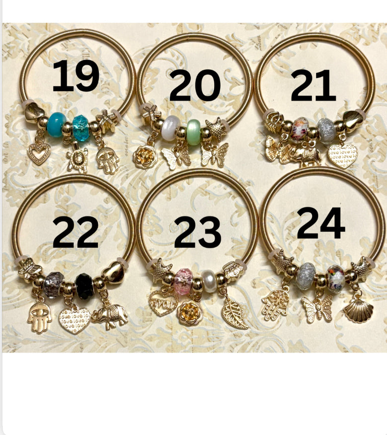 Stylish gold Pandora-inspired charm bracelets with hearts, butterflies, and trees. Elegant adjustable bangles perfect for gifting or everyday use. 