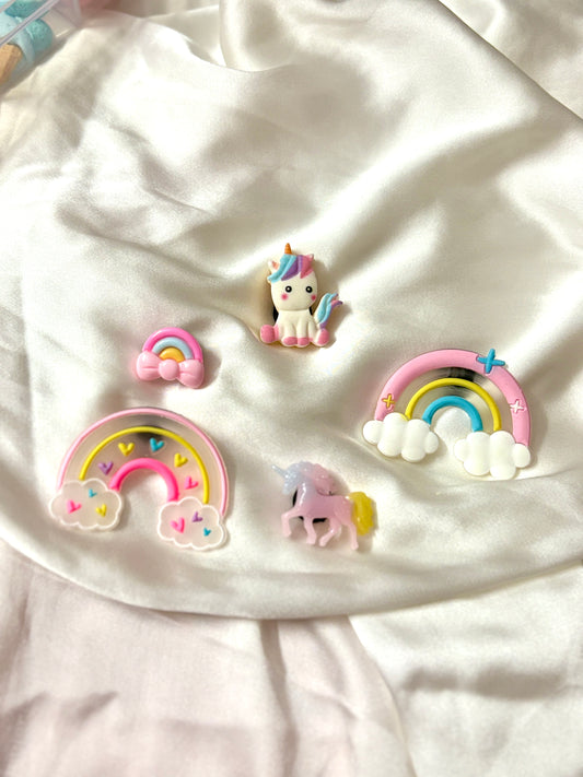 Set of 5 unicorn and rainbow-themed Crocs Jibbitz charms featuring pastel unicorns, clouds, hearts, and colorful rainbows for a dreamy, magical shoe upgrade.