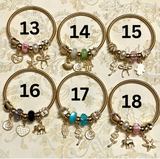 Stylish gold Pandora-inspired charm bracelets with hearts, butterflies, and trees. Elegant adjustable bangles perfect for gifting or everyday use. 
