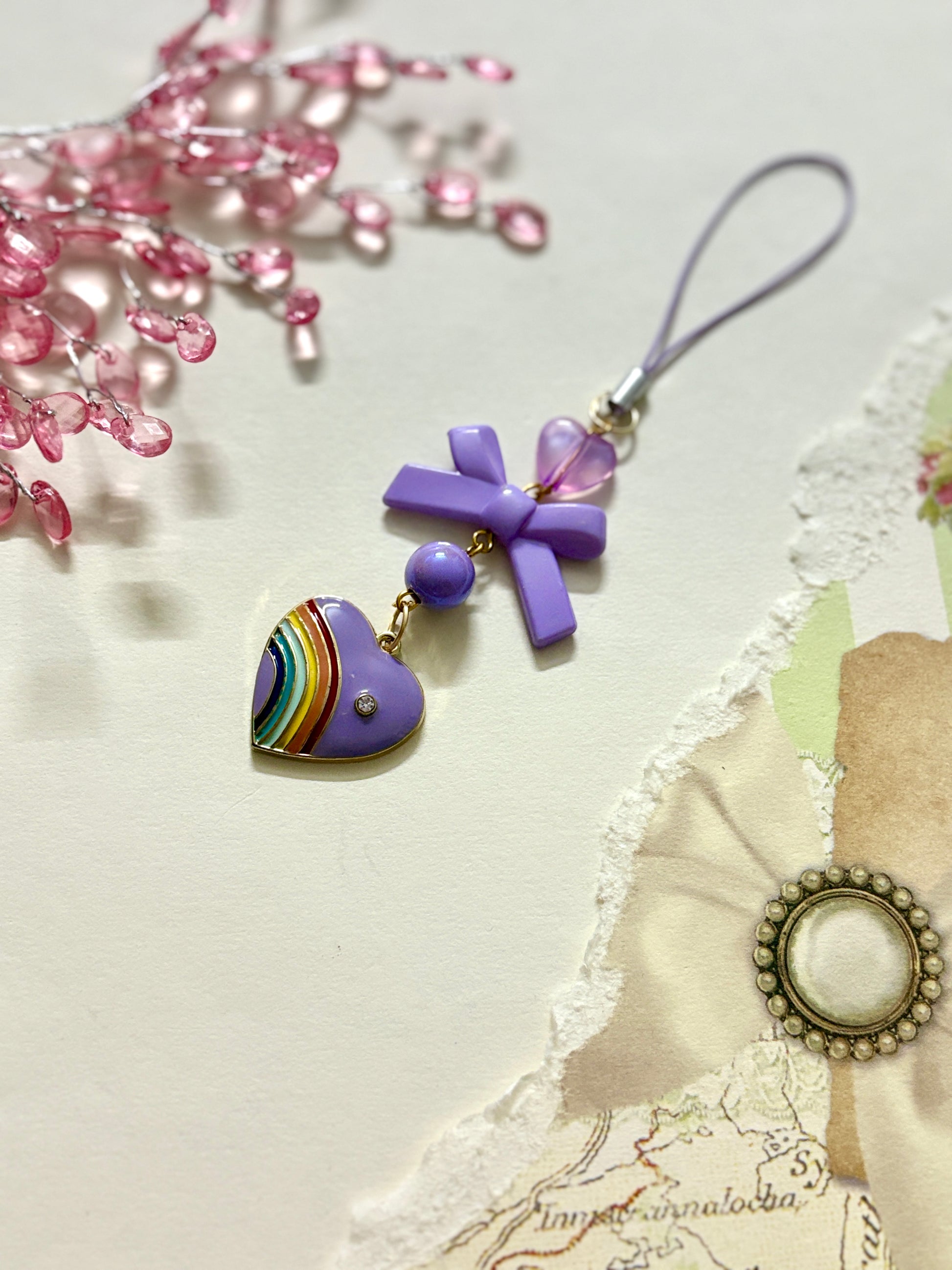 Rainbow pride heart phone charm with cross, heart, and round beads — a colorful and meaningful accessory available in four unique variations.